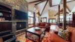 Gorgeous wood beams and vaulted ceilings with stone accents